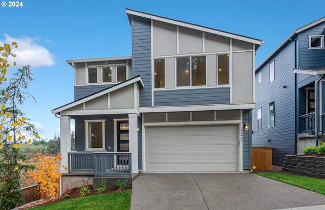 view of front of home featuring a garage and covered porch