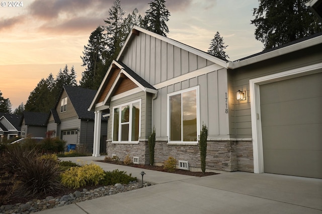 property exterior at dusk with a garage