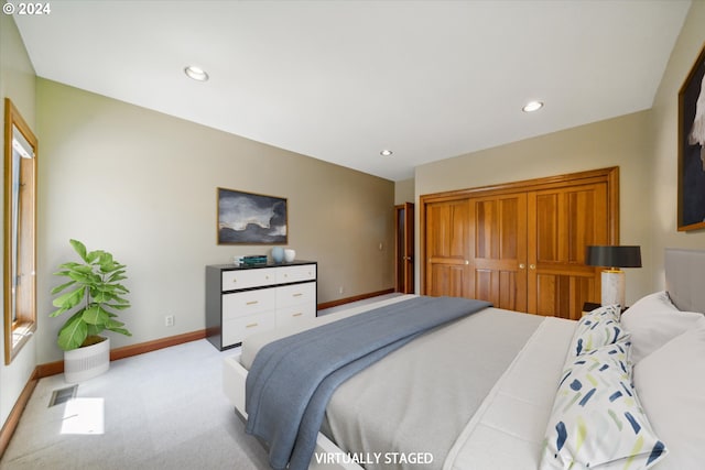 carpeted bedroom featuring a closet