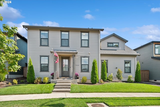 front facade with a front yard