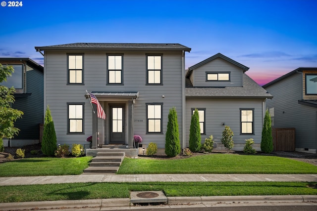 front facade featuring a yard