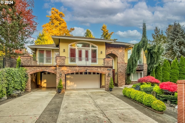 view of front of house featuring a balcony and a garage