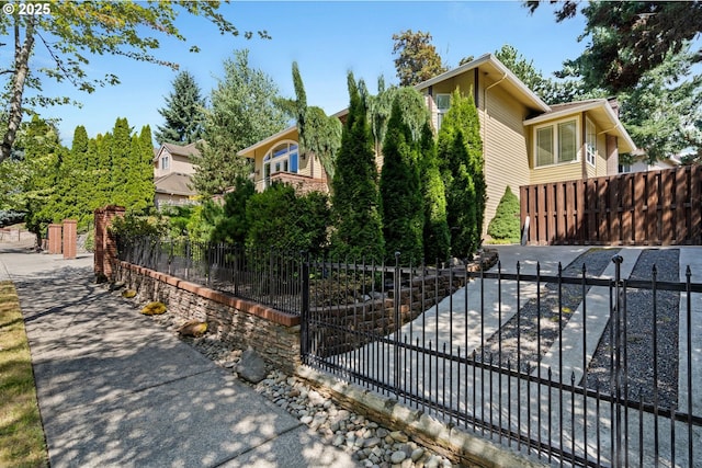 view of front of property featuring fence