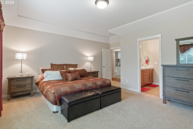 carpeted bedroom featuring connected bathroom