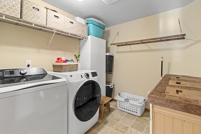 clothes washing area featuring washing machine and dryer