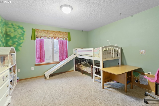 carpeted bedroom with a textured ceiling