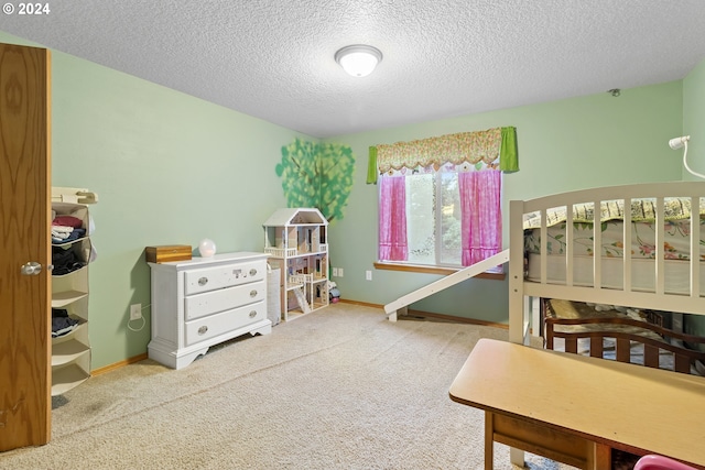 carpeted bedroom featuring a textured ceiling