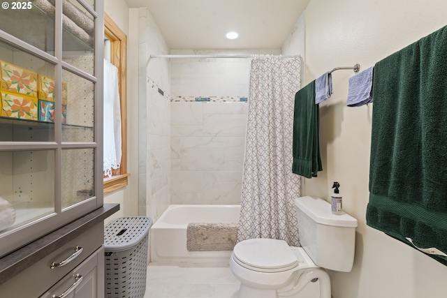 bathroom featuring toilet and shower / bath combo