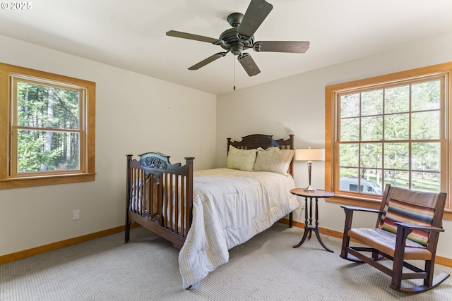 bedroom with baseboards, ceiling fan, and carpet flooring