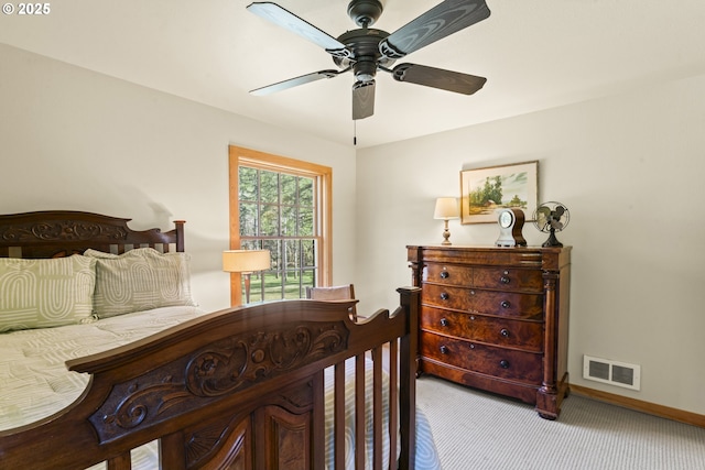 bedroom with carpet flooring, visible vents, baseboards, and ceiling fan