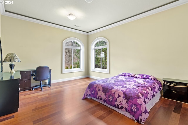 bedroom featuring hardwood / wood-style floors and ornamental molding