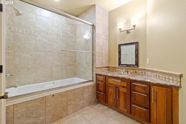 bathroom with shower / bath combination with glass door, vanity, and tile floors