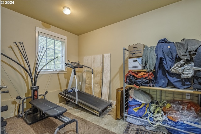 workout area featuring concrete flooring