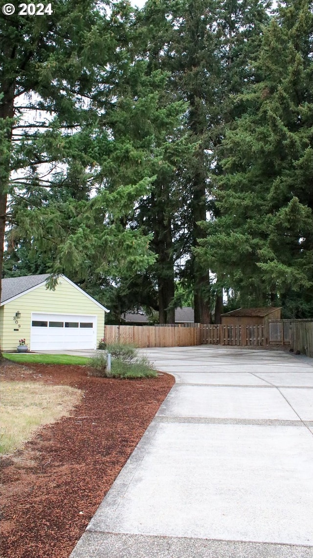 exterior space featuring an outdoor structure and a garage