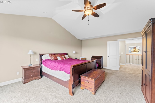 bedroom featuring ceiling fan, light colored carpet, and lofted ceiling