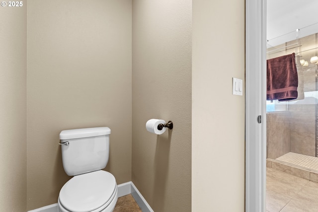 bathroom with tile patterned floors and toilet