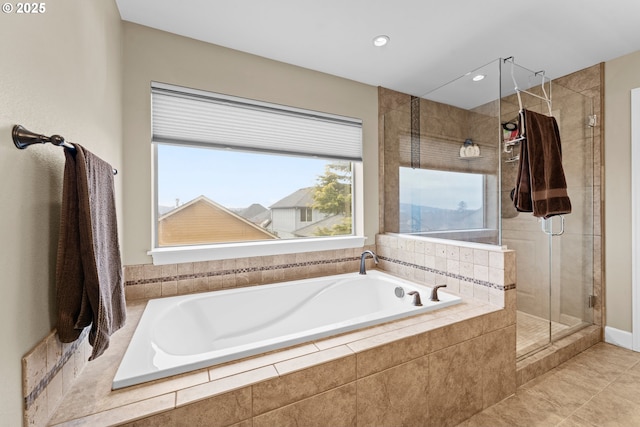 bathroom with tile patterned floors and plus walk in shower