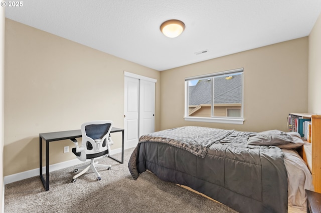 carpeted bedroom with a closet