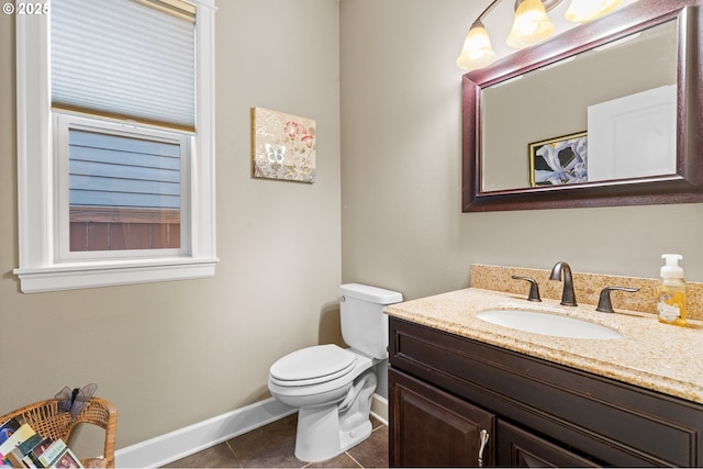 bathroom featuring vanity, toilet, and tile patterned flooring