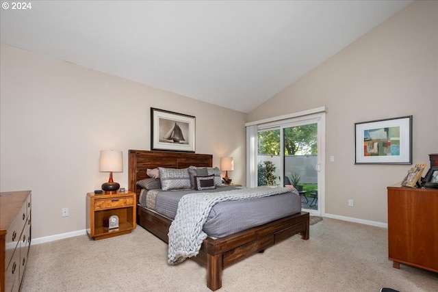 bedroom with access to exterior, light colored carpet, and lofted ceiling