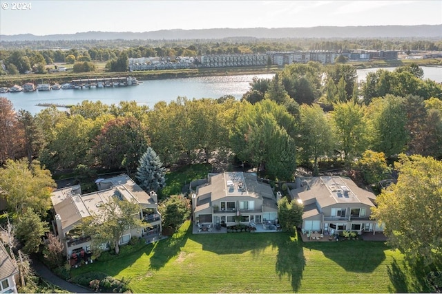 birds eye view of property with a water view