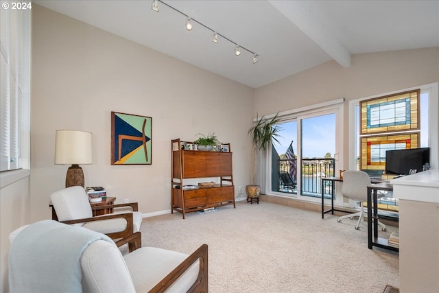 home office with light carpet and lofted ceiling with beams