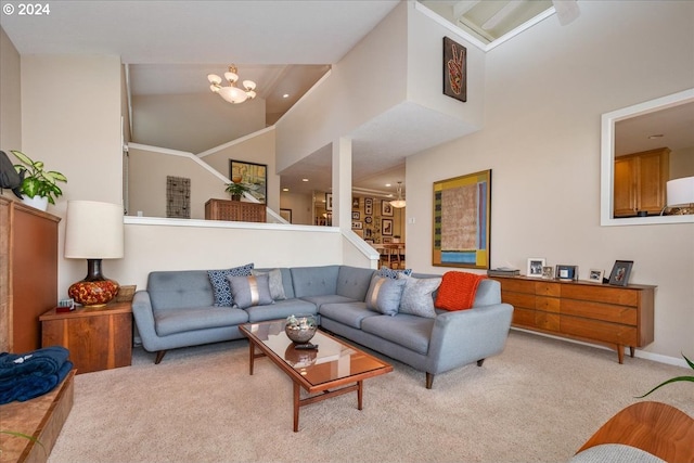 carpeted living room with a high ceiling and an inviting chandelier