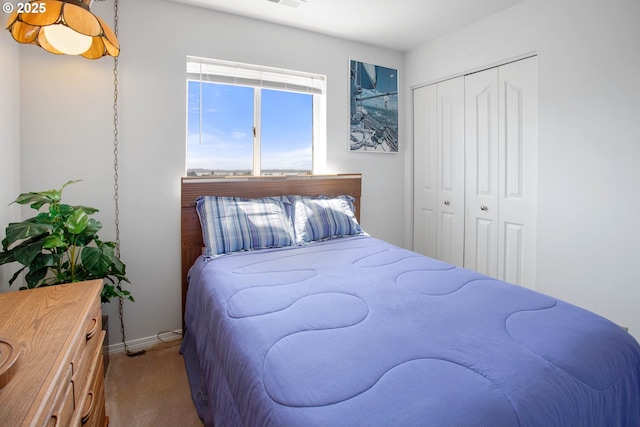 carpeted bedroom with a closet