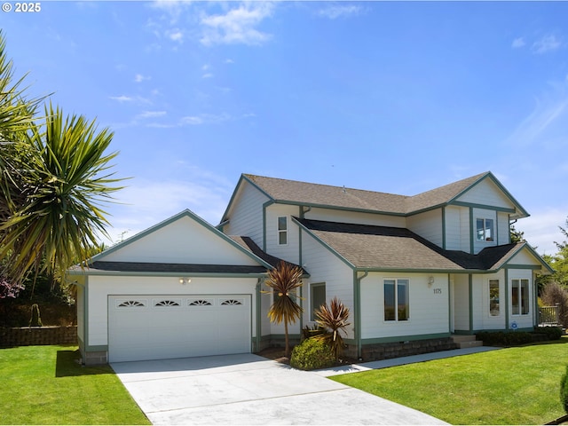 view of front facade with a front yard and a garage