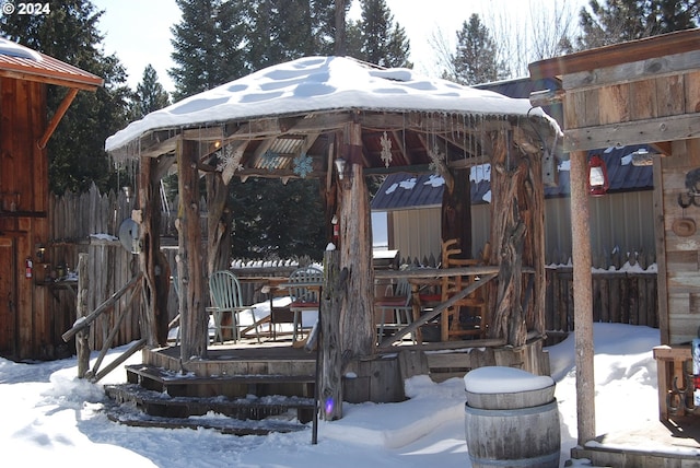 snow covered patio featuring a gazebo