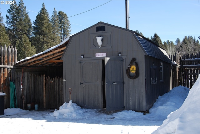 view of snow covered garage