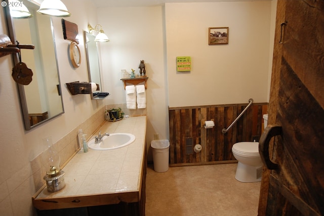 bathroom featuring toilet and oversized vanity