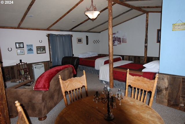 bedroom featuring carpet floors and vaulted ceiling with beams