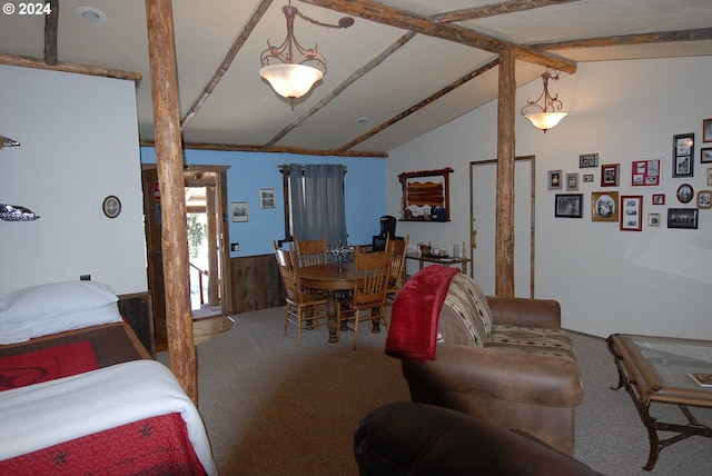 bedroom with lofted ceiling with beams and carpet flooring