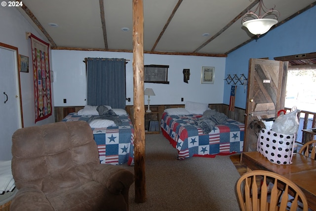 bedroom with vaulted ceiling with beams