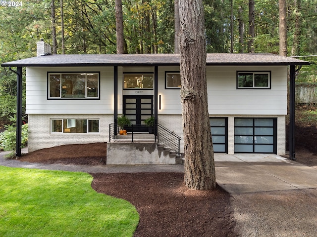 split foyer home featuring a garage