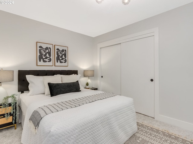 carpeted bedroom with a closet