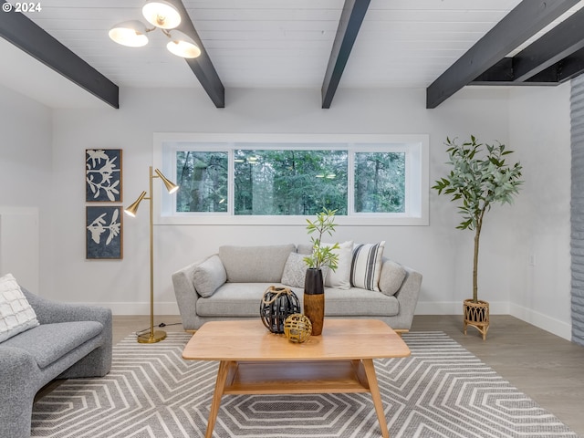 living room featuring wood ceiling, beamed ceiling, plenty of natural light, and hardwood / wood-style floors