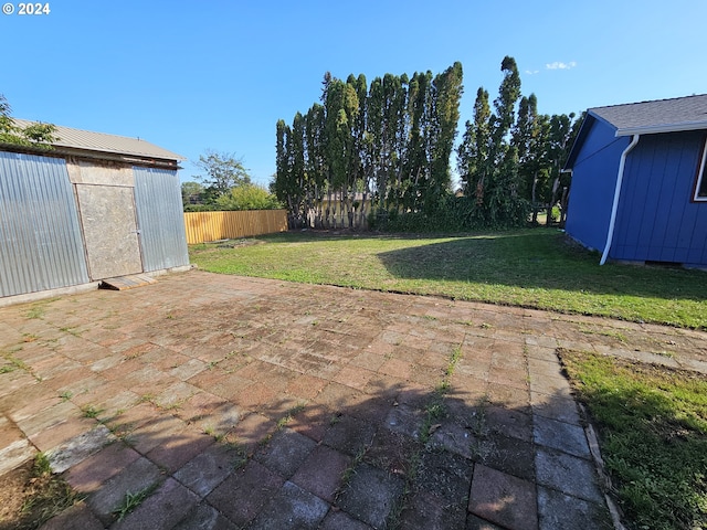 view of patio with a shed