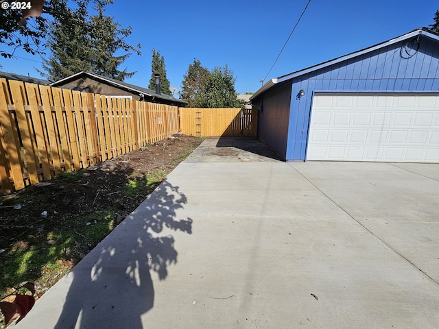 view of side of home with a garage