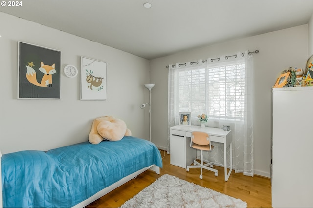 bedroom featuring wood finished floors