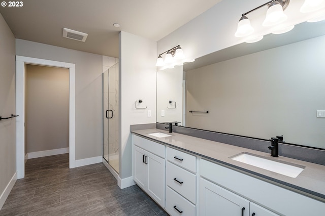 bathroom featuring walk in shower, tile floors, and vanity