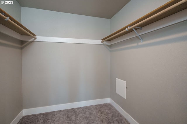 laundry area with dark wood-type flooring, hookup for a washing machine, and electric dryer hookup