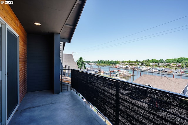 balcony featuring a water view