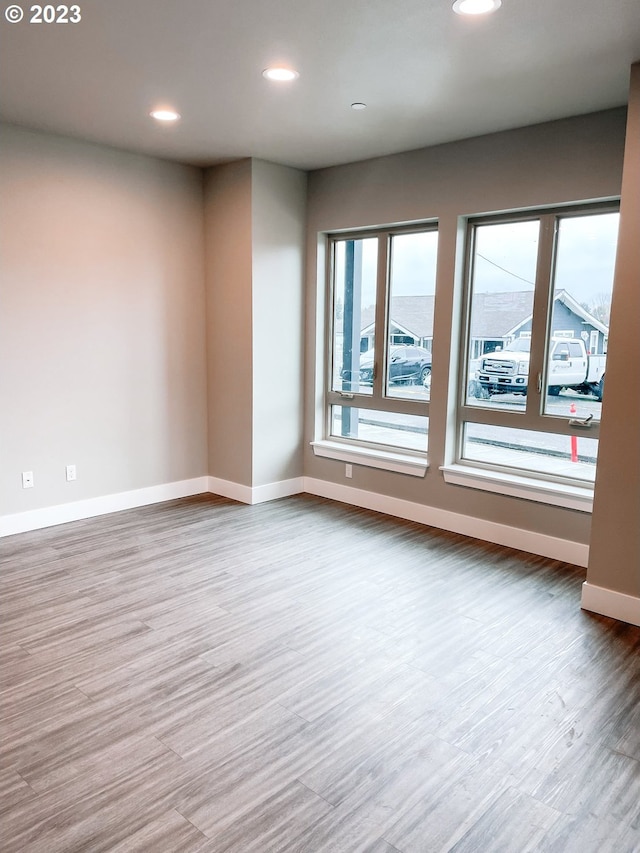 spare room featuring hardwood / wood-style flooring