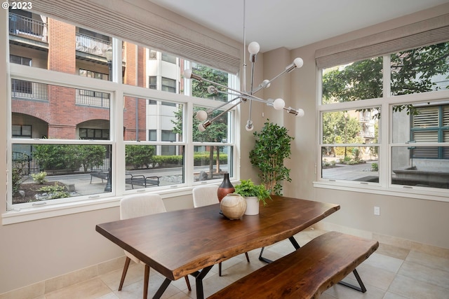 sunroom featuring an inviting chandelier