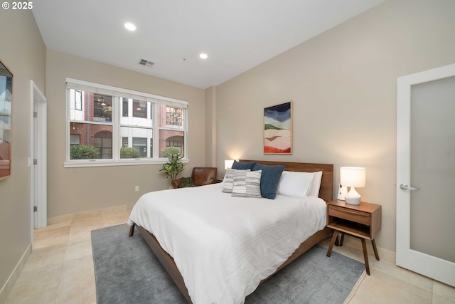 820 NW 12th Ave Unit 110, Portland, OR 97209 - bedroom with baseboards, light tile patterned flooring, visible vents, and recessed lighting
