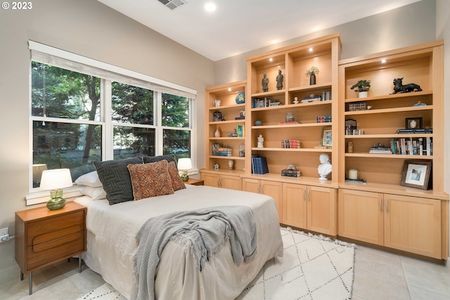 bedroom featuring light tile patterned flooring