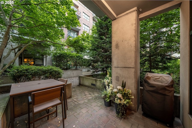 820 NW 12th Ave Unit 110, Portland, OR 97209 - view of patio / terrace featuring a grill and outdoor dining space