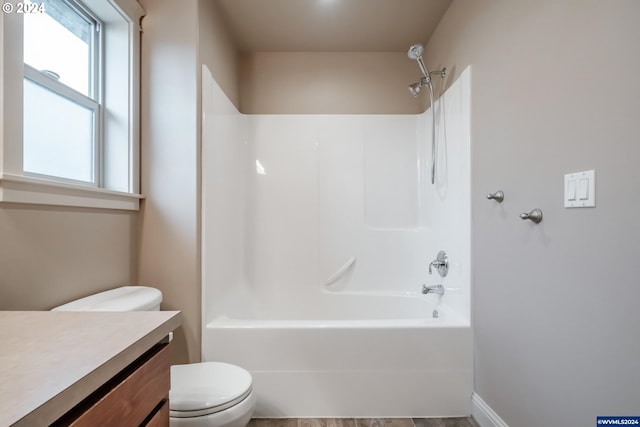 full bathroom with shower / washtub combination, vanity, and toilet